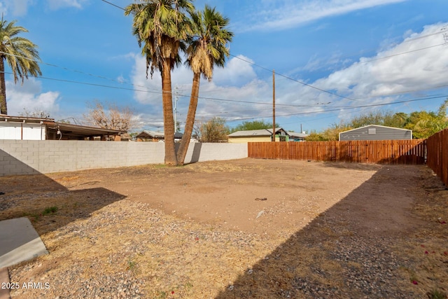 view of yard with a fenced backyard