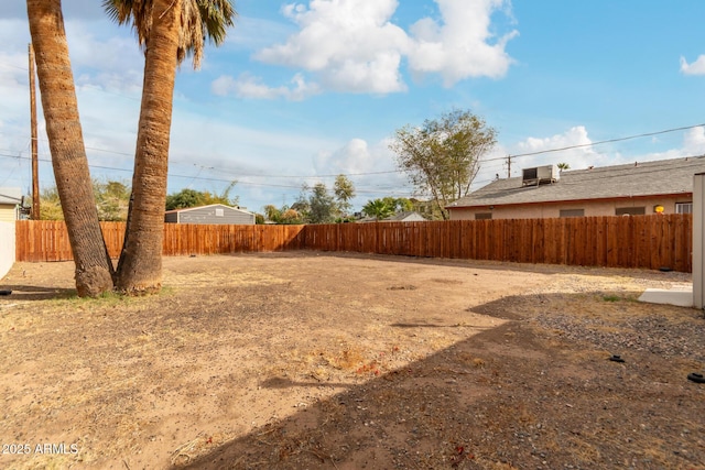 view of yard with a fenced backyard