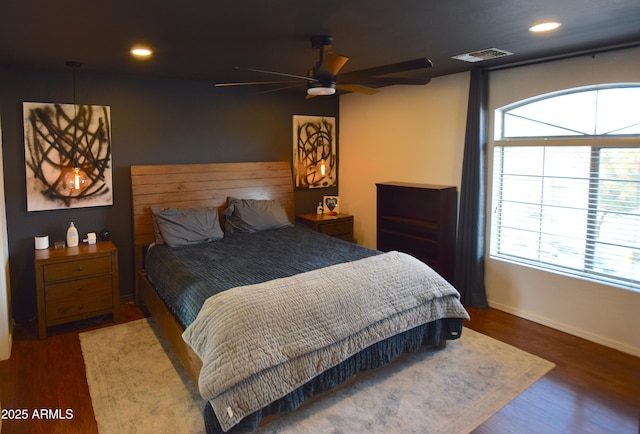 bedroom featuring ceiling fan and dark hardwood / wood-style flooring