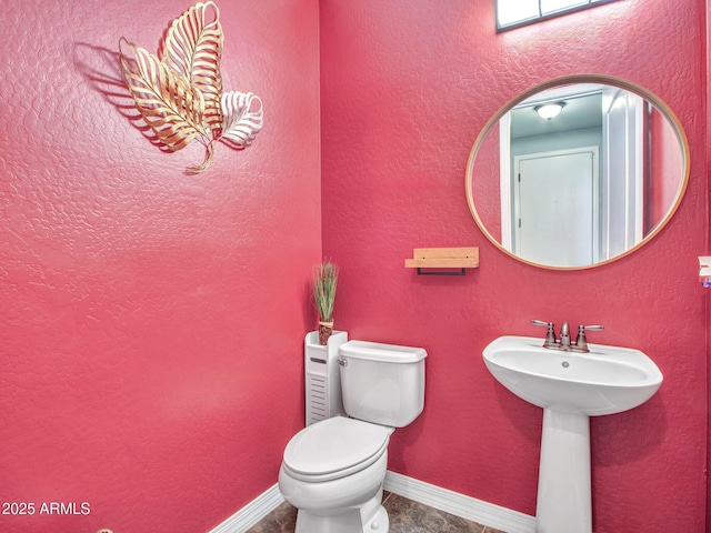 bathroom with sink and toilet