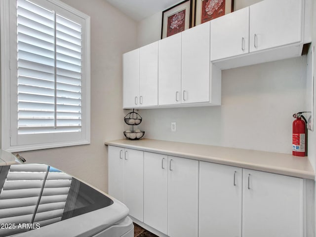 kitchen featuring white cabinets