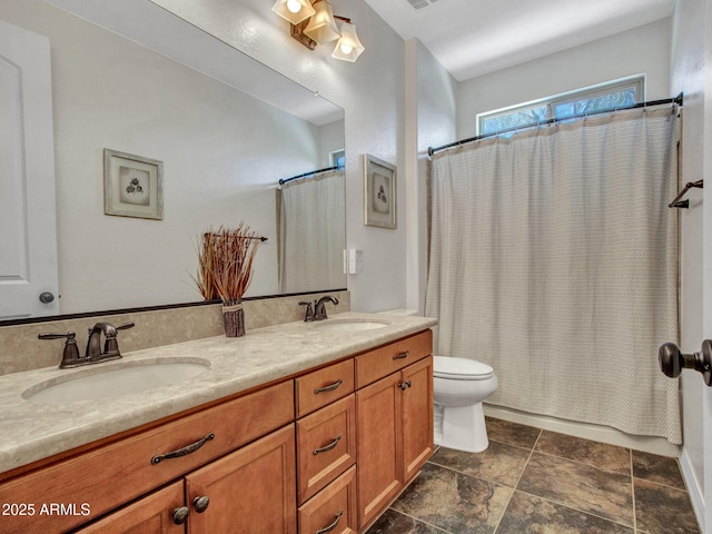 full bathroom with shower / bath combination with curtain, vanity, and toilet