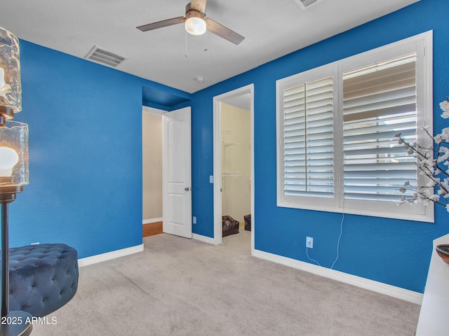 unfurnished bedroom with light carpet and ceiling fan