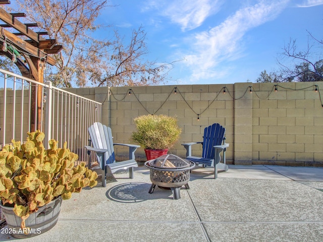 view of patio / terrace with an outdoor fire pit