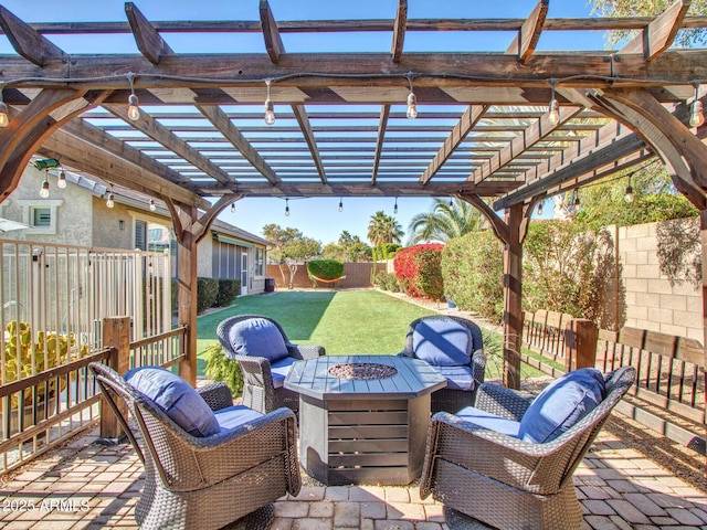 view of patio / terrace with a pergola and a fire pit