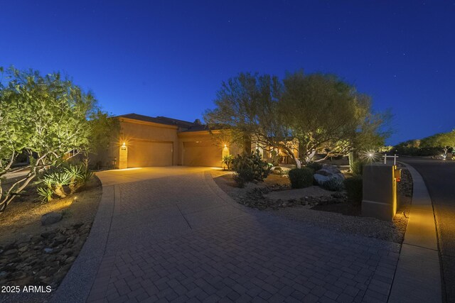 8248 E Arroyo Hondo Rd, Scottsdale, AZ 85266 - view of front facade featuring a garage, driveway, and stucco siding