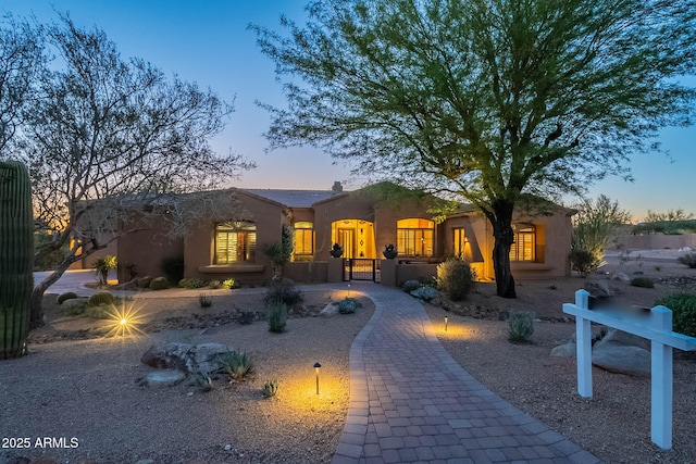 8248 E Arroyo Hondo Rd, Scottsdale, AZ 85266 - view of front of property with stucco siding and a gate