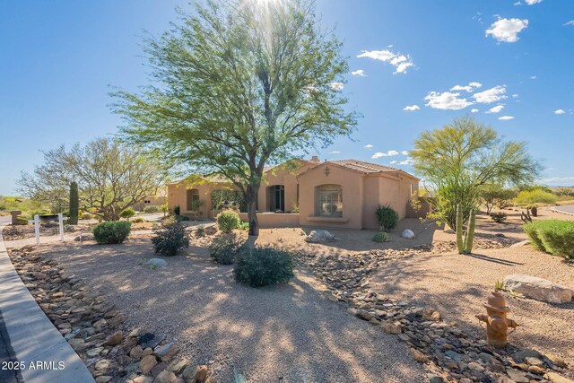8248 E Arroyo Hondo Rd, Scottsdale, AZ 85266 - mediterranean / spanish house featuring stucco siding and a tile roof