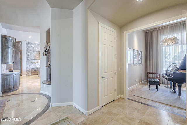 8248 E Arroyo Hondo Rd, Scottsdale, AZ 85266 - foyer entrance with baseboards and inlaid floor details