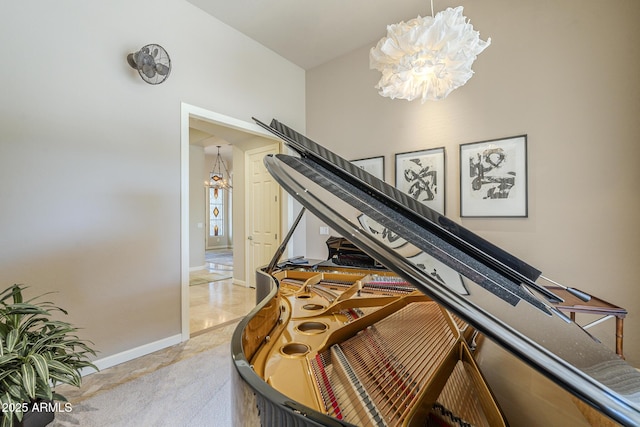 8248 E Arroyo Hondo Rd, Scottsdale, AZ 85266 - living area with a chandelier, baseboards, and light carpet