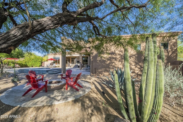 8248 E Arroyo Hondo Rd, Scottsdale, AZ 85266 - view of patio / terrace featuring an outdoor fire pit