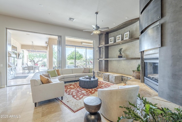 8248 E Arroyo Hondo Rd, Scottsdale, AZ 85266 - living room with a large fireplace and ceiling fan