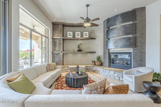 8248 E Arroyo Hondo Rd, Scottsdale, AZ 85266 - living area with a large fireplace, a ceiling fan, and recessed lighting