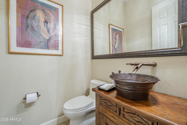 8248 E Arroyo Hondo Rd, Scottsdale, AZ 85266 - half bathroom featuring toilet and vanity