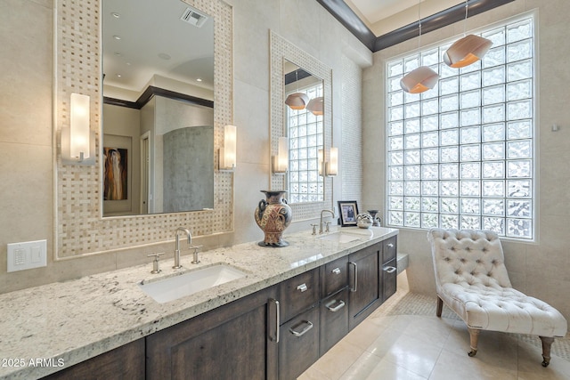 8248 E Arroyo Hondo Rd, Scottsdale, AZ 85266 - full bath with tile walls, tile patterned flooring, plenty of natural light, and double vanity