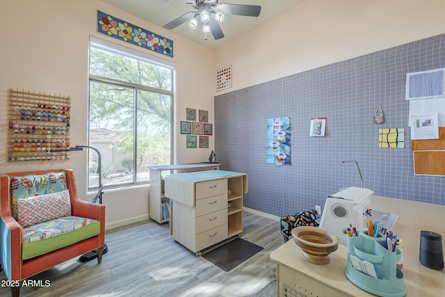8248 E Arroyo Hondo Rd, Scottsdale, AZ 85266 - office area with light wood-style floors, ceiling fan, and baseboards