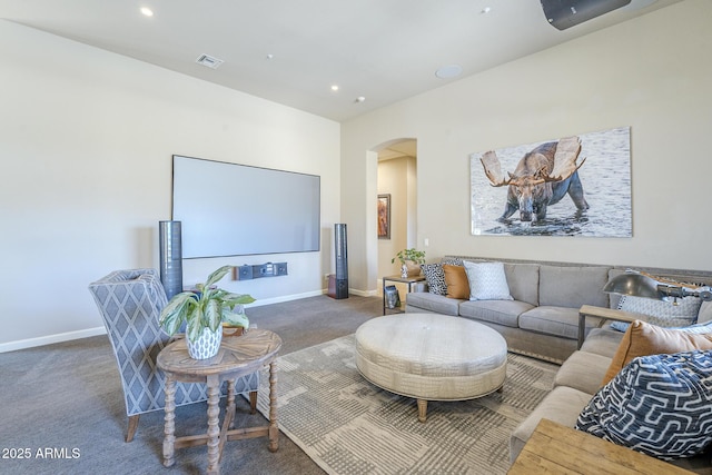 8248 E Arroyo Hondo Rd, Scottsdale, AZ 85266 - living room with arched walkways, carpet flooring, baseboards, and recessed lighting