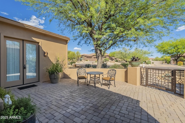 8248 E Arroyo Hondo Rd, Scottsdale, AZ 85266 - view of patio / terrace featuring french doors