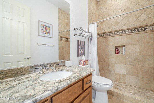 8248 E Arroyo Hondo Rd, Scottsdale, AZ 85266 - full bathroom featuring vanity, tiled shower, and toilet
