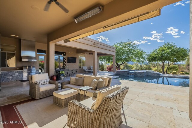 8248 E Arroyo Hondo Rd, Scottsdale, AZ 85266 - view of patio featuring exterior kitchen, outdoor lounge area, a ceiling fan, grilling area, and a pool with connected hot tub