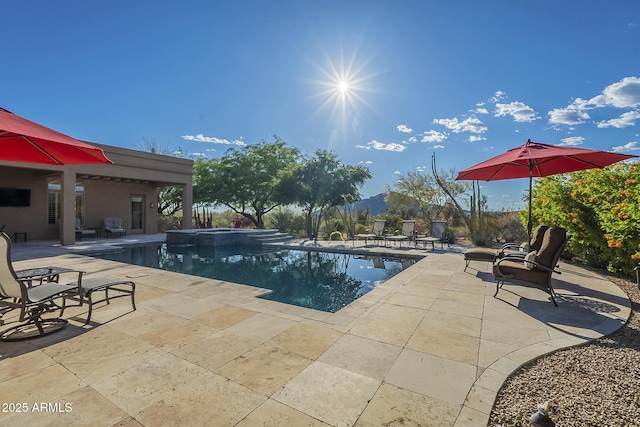 8248 E Arroyo Hondo Rd, Scottsdale, AZ 85266 - view of swimming pool with a patio and a pool with connected hot tub