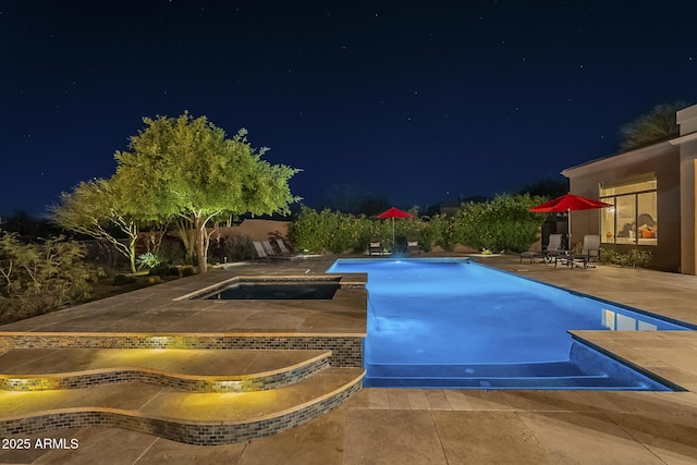 8248 E Arroyo Hondo Rd, Scottsdale, AZ 85266 - pool at twilight featuring an in-ground hot tub, a patio area, and an outdoor pool