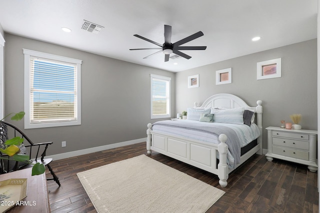 bedroom with visible vents, baseboards, dark wood-style flooring, and recessed lighting