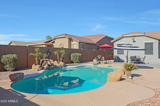 view of swimming pool featuring a patio, a residential view, a fenced backyard, and a fenced in pool