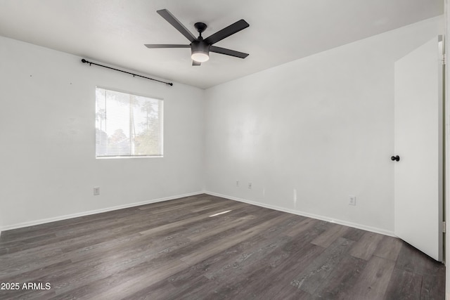 unfurnished room featuring ceiling fan and dark wood-type flooring