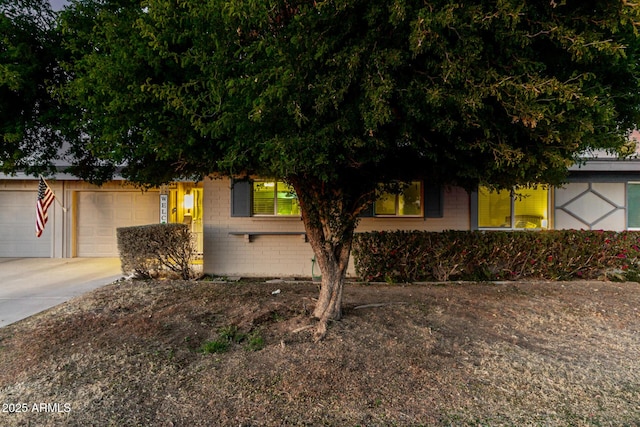 obstructed view of property featuring a garage