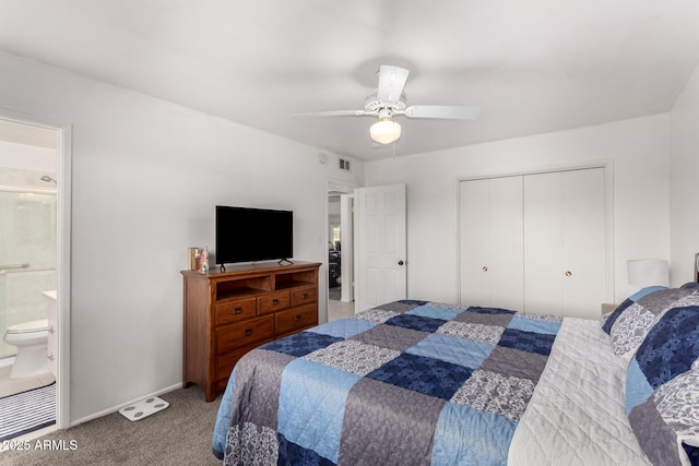 carpeted bedroom with ceiling fan, ensuite bathroom, and a closet