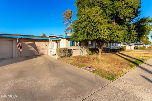 view of front of house with a garage and a front yard