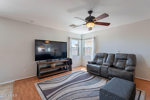 5305 E Silverbell Rd, San Tan Valley, AZ 85143 - living room with a ceiling fan, light wood finished floors, and baseboards
