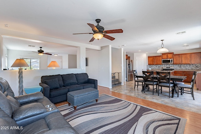 5305 E Silverbell Rd, San Tan Valley, AZ 85143 - living room with ceiling fan and light wood finished floors