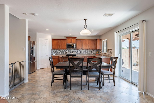 5305 E Silverbell Rd, San Tan Valley, AZ 85143 - dining area with baseboards and recessed lighting