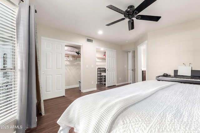 bedroom with baseboards, visible vents, a ceiling fan, dark wood-type flooring, and recessed lighting