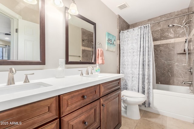 full bath with visible vents, a sink, toilet, and shower / bath combo with shower curtain