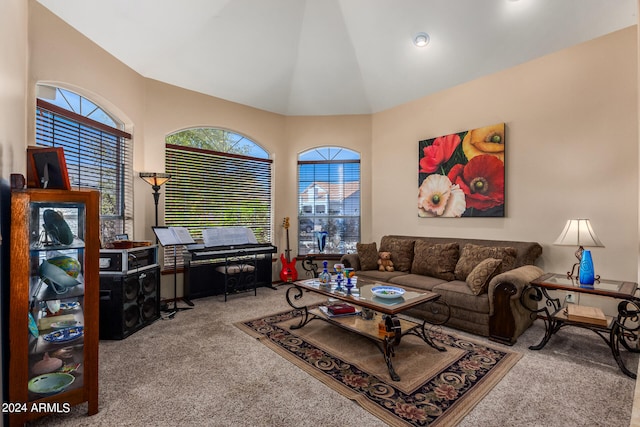 carpeted living room featuring vaulted ceiling