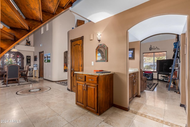 interior space featuring wood ceiling and light tile patterned floors