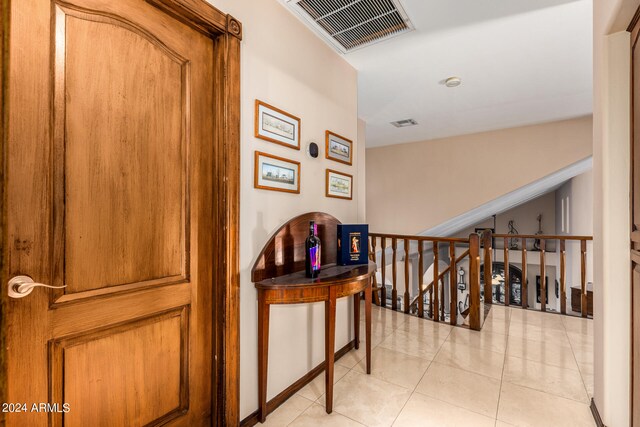 corridor featuring light tile patterned flooring