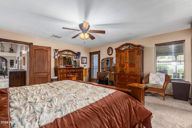 carpeted bedroom with ceiling fan