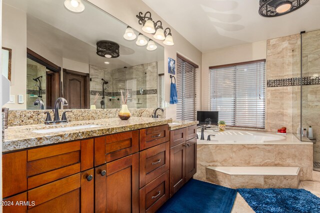 bathroom featuring vanity and shower with separate bathtub