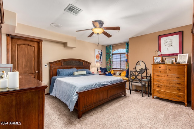 bedroom with light colored carpet and ceiling fan