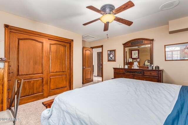 bedroom with ceiling fan and light carpet