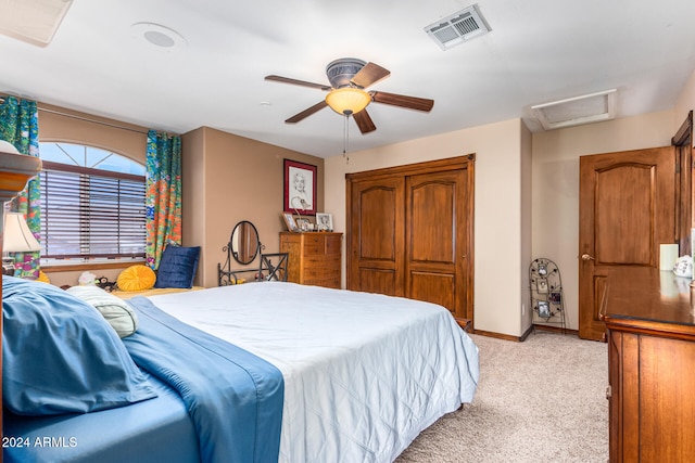 carpeted bedroom featuring ceiling fan