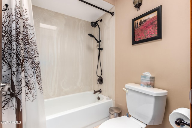 bathroom featuring toilet and shower / bathtub combination with curtain