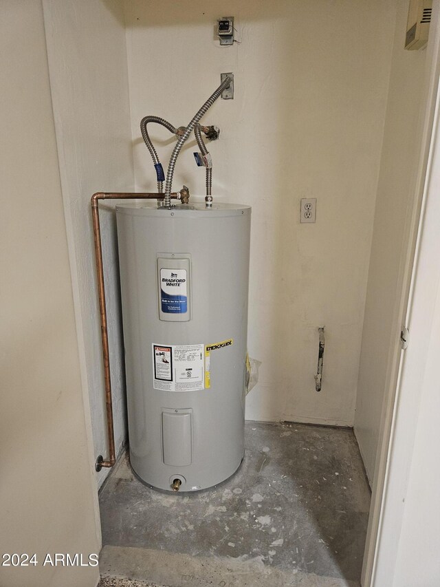 utility room with water heater