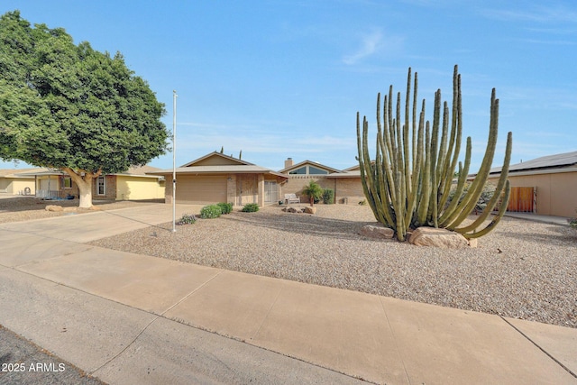 view of front of house with a garage and concrete driveway