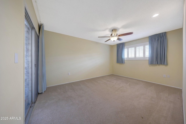 unfurnished bedroom featuring carpet, baseboards, ceiling fan, and recessed lighting