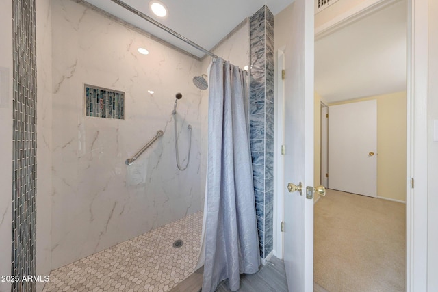 full bath featuring a marble finish shower